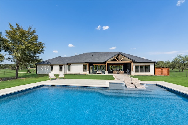 view of pool featuring a yard and a patio