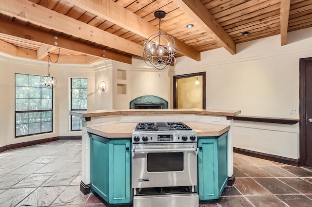 kitchen featuring beamed ceiling, decorative light fixtures, gas stove, and blue cabinetry