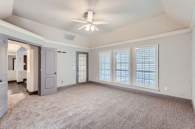 unfurnished room with ornamental molding, a textured ceiling, light colored carpet, ceiling fan, and lofted ceiling