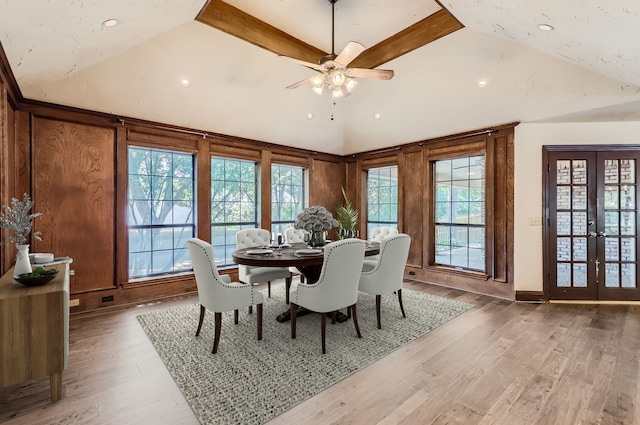 dining room with ceiling fan, french doors, hardwood / wood-style floors, and lofted ceiling