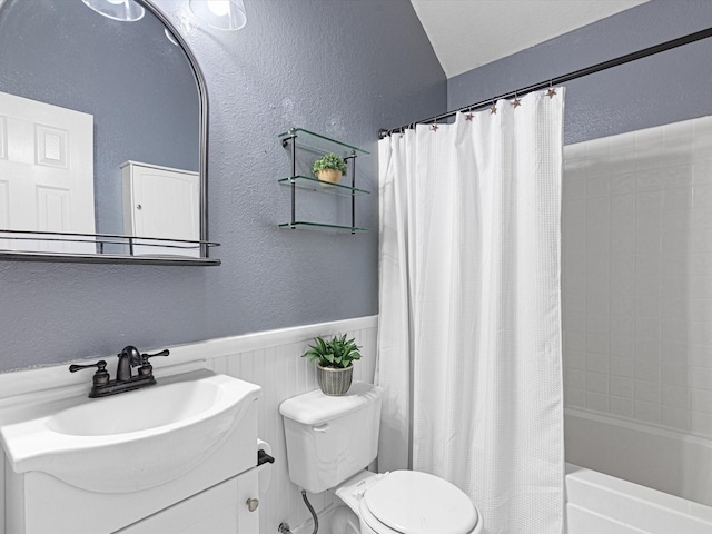 bathroom with a textured wall, wainscoting, toilet, and shower / bathtub combination with curtain