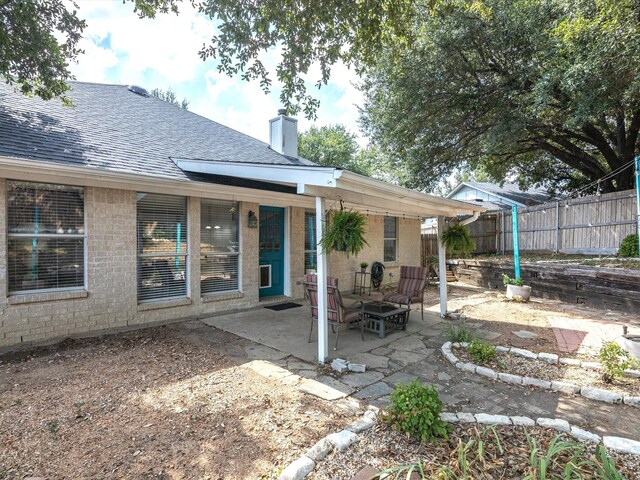 back of house featuring a patio area