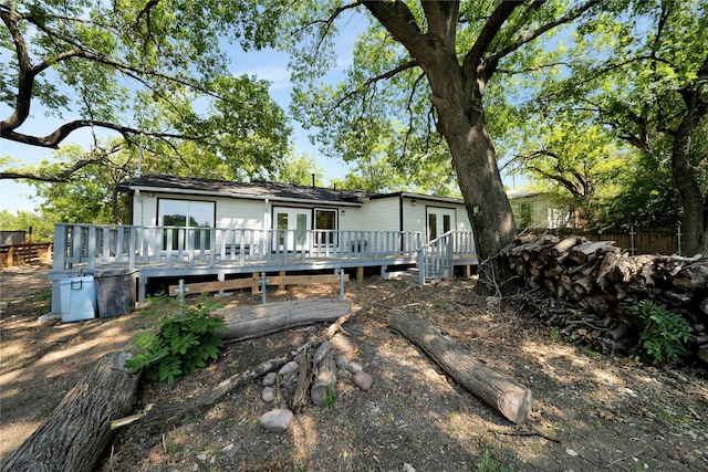 view of front of home featuring french doors and a wooden deck