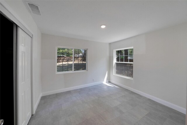 interior space featuring a closet and light tile patterned flooring