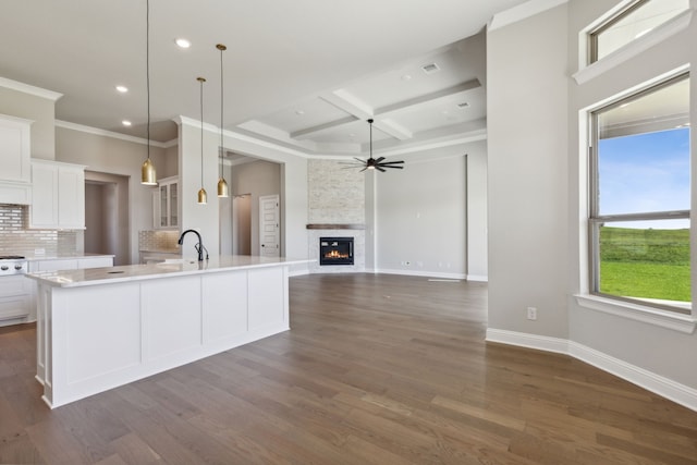 kitchen with white cabinets, dark hardwood / wood-style floors, and hanging light fixtures