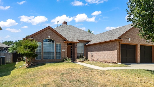 view of front of house with a front lawn and a garage