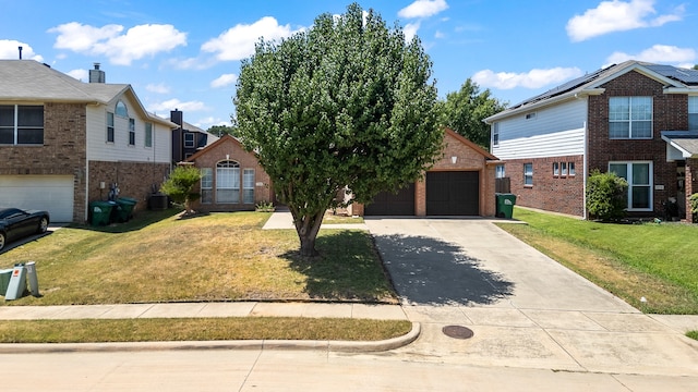 view of property with a front yard, an outdoor structure, and a garage