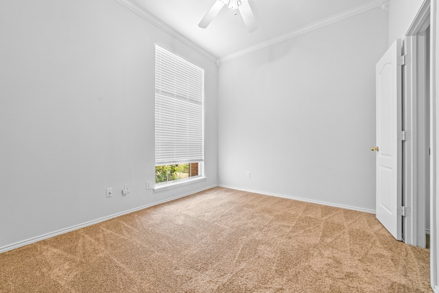 unfurnished bedroom with ceiling fan, crown molding, and light colored carpet