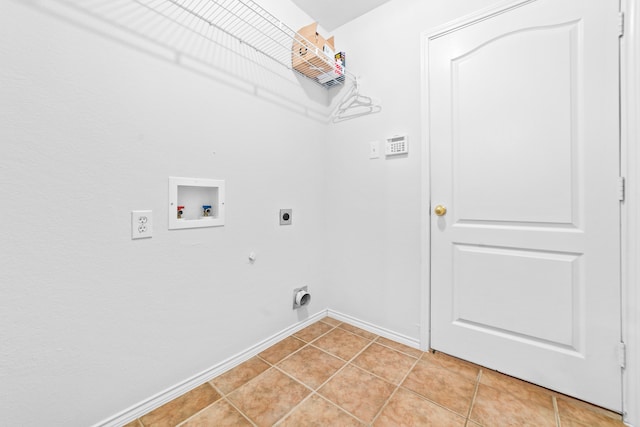 laundry area with hookup for an electric dryer, hookup for a washing machine, light tile patterned flooring, and gas dryer hookup