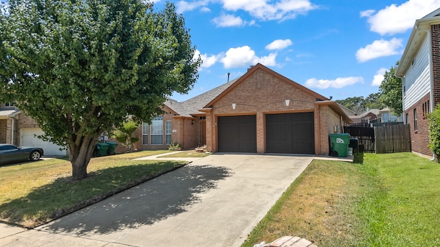 view of front of home featuring a garage and a front yard