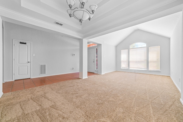 unfurnished living room featuring tile patterned flooring, a tray ceiling, and a chandelier