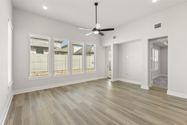 empty room featuring ceiling fan and light hardwood / wood-style flooring