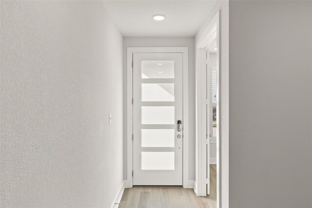 doorway to outside with light hardwood / wood-style floors