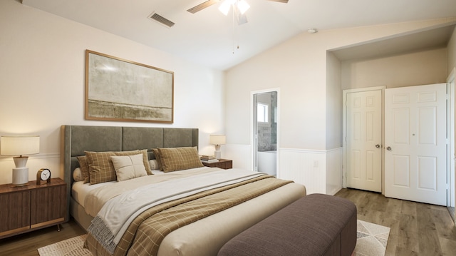 bedroom with wood-type flooring, ceiling fan, lofted ceiling, and a closet