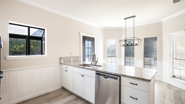 kitchen featuring white cabinetry, kitchen peninsula, light stone countertops, crown molding, and dishwasher