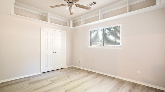 unfurnished bedroom with a closet, ceiling fan, and light hardwood / wood-style flooring