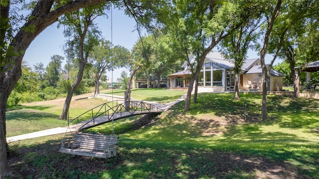 view of property's community featuring a yard