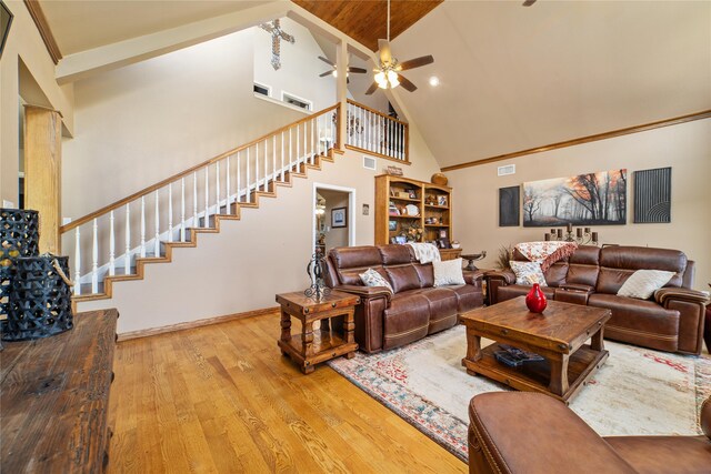 living room with ceiling fan, high vaulted ceiling, and light hardwood / wood-style floors