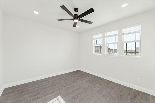 unfurnished room featuring hardwood / wood-style floors and ceiling fan