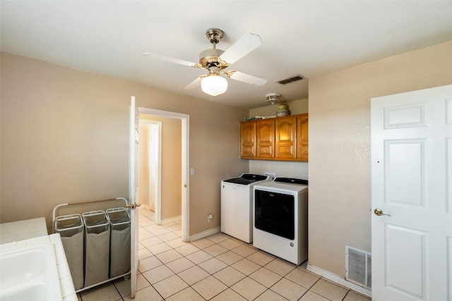 clothes washing area featuring ceiling fan, cabinet space, visible vents, and independent washer and dryer