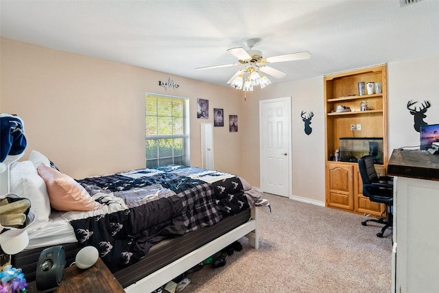 carpeted bedroom featuring a ceiling fan