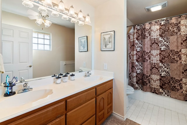 bathroom with ceiling fan, tile patterned floors, vanity, and toilet