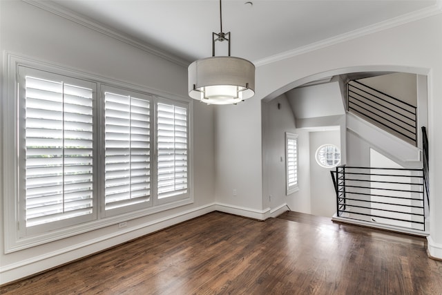 interior space with ornamental molding and dark wood-type flooring