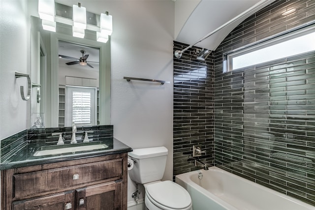 full bathroom with toilet, tiled shower / bath combo, vanity, and ceiling fan