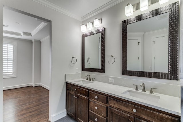 bathroom with vanity, ornamental molding, and hardwood / wood-style floors