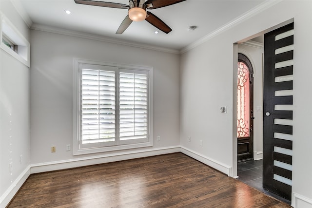 interior space with ceiling fan, ornamental molding, and dark hardwood / wood-style flooring