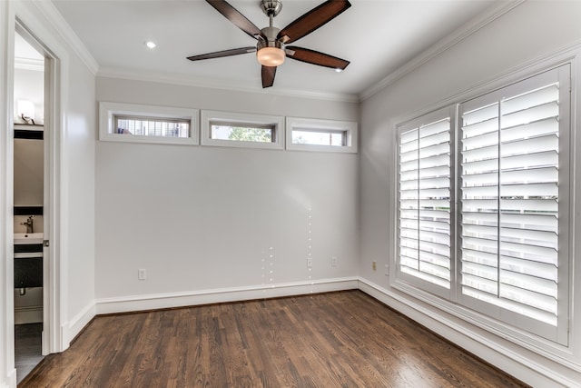 spare room with crown molding, ceiling fan, sink, and dark hardwood / wood-style flooring