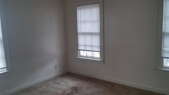 empty room with carpet flooring