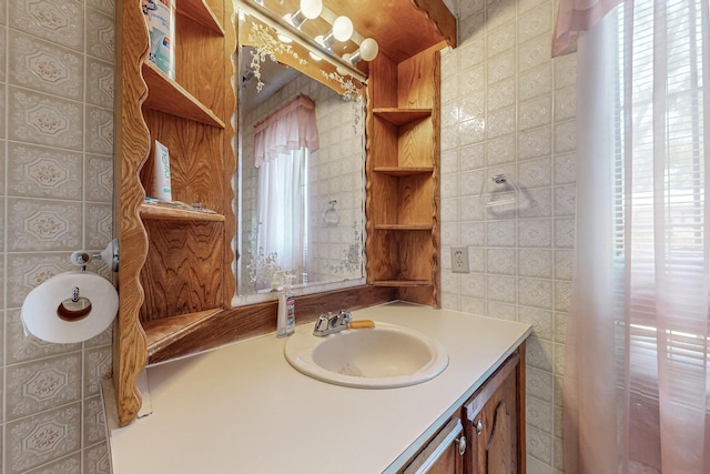 bathroom featuring tile walls, a wealth of natural light, and vanity