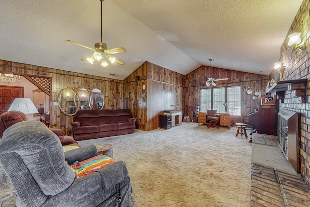 living room with ceiling fan, wooden walls, a brick fireplace, vaulted ceiling, and a textured ceiling