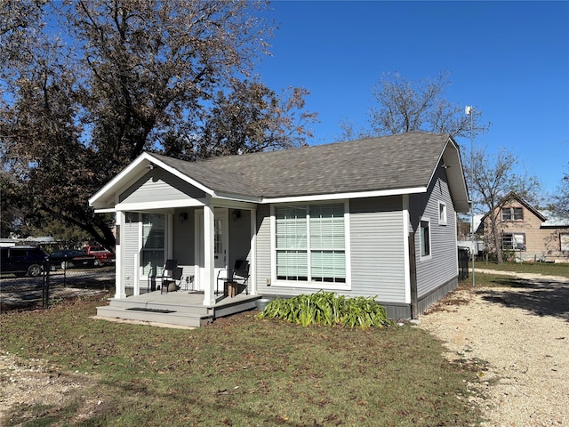 view of front of property with a porch and a front yard