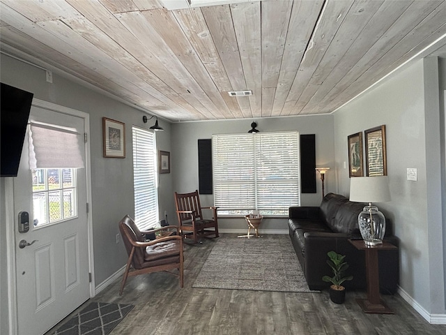 sitting room with wood ceiling and hardwood / wood-style flooring