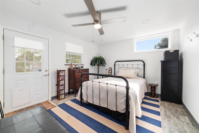 bedroom featuring light wood-type flooring and ceiling fan