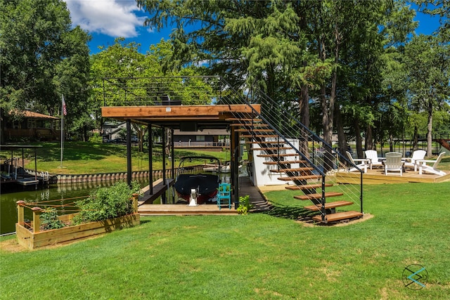 view of home's community featuring a lawn, a boat dock, and a water view