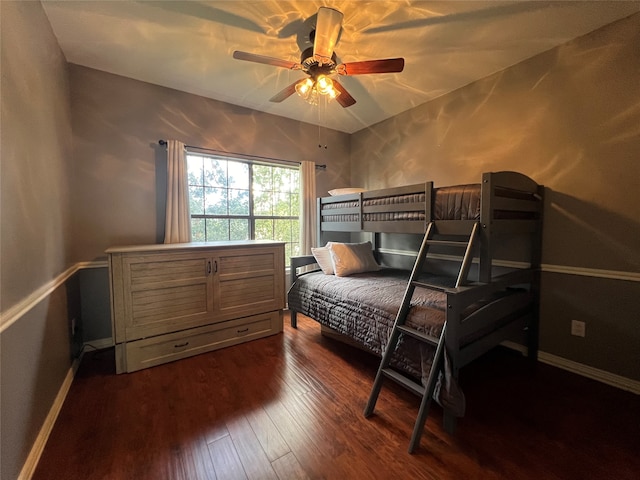 bedroom with dark wood-type flooring and ceiling fan