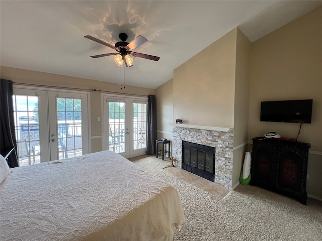 bedroom with vaulted ceiling, light colored carpet, access to exterior, and french doors