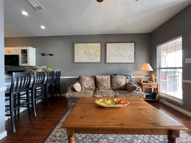 living room featuring dark hardwood / wood-style floors