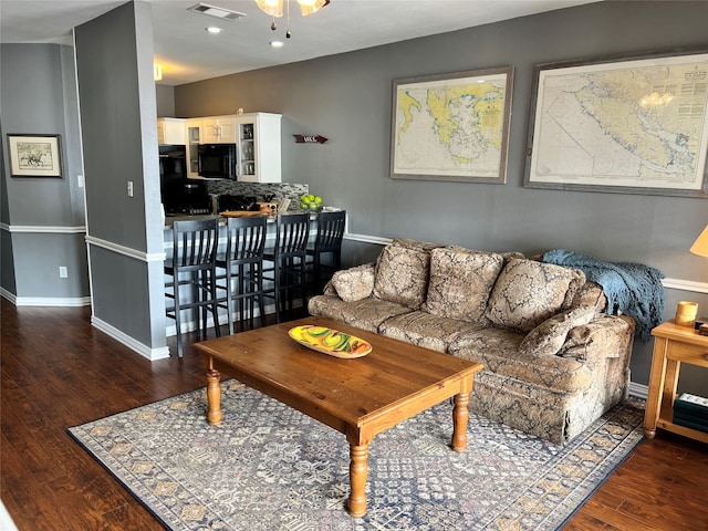 living room with dark hardwood / wood-style floors