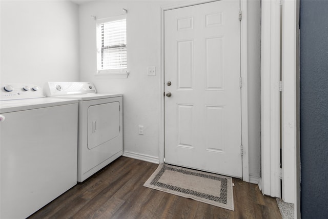 washroom featuring dark wood-type flooring and washing machine and dryer