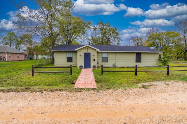 ranch-style home with a front yard