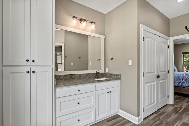 bathroom featuring vanity and hardwood / wood-style floors