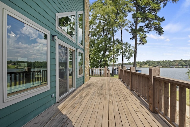 wooden terrace featuring a water view