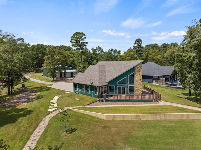 back of property featuring a lawn