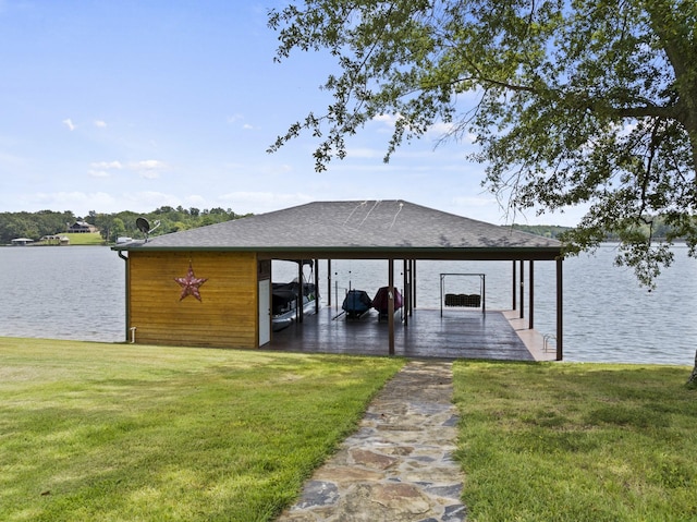 dock area featuring a yard, a water view, and boat lift