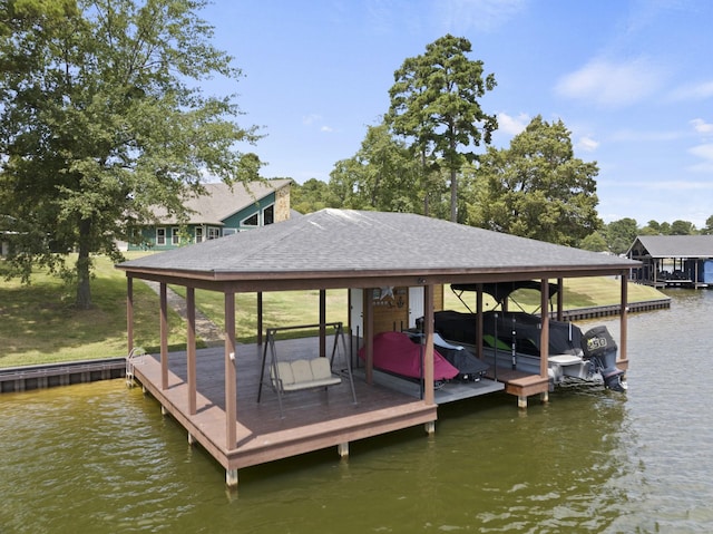 view of dock featuring a water view and boat lift