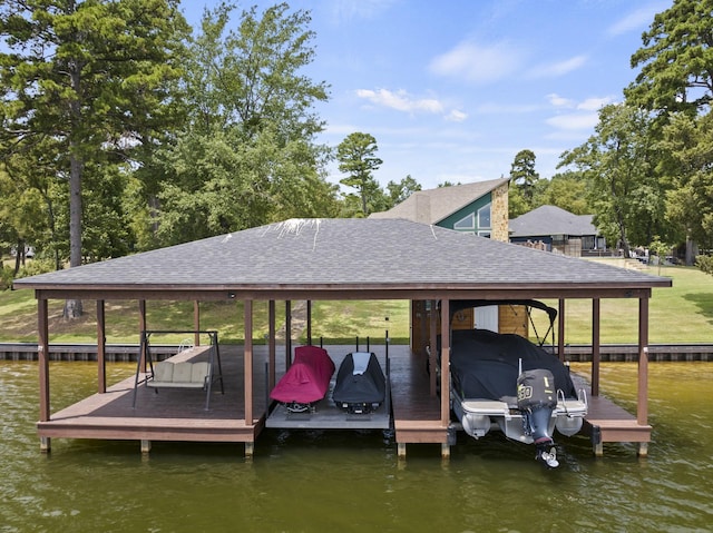 dock area featuring a water view and boat lift